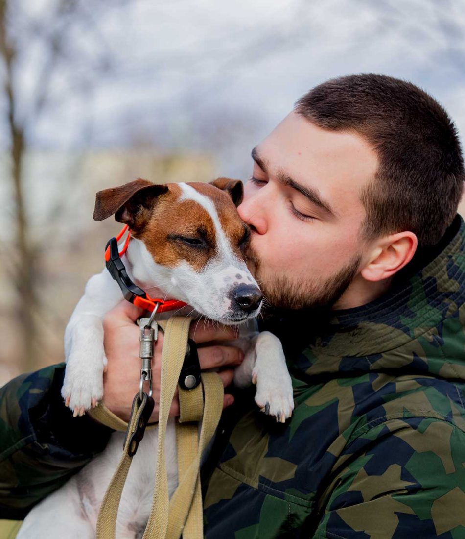 young-man-with-his-dog-jack-russell-terrier-2022-01-12-05-09-31-utc.jpg